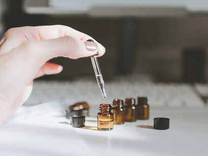 Pioneering her skincare routine, a woman is handcrafting her unique blend of nourishing oils