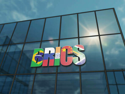 A conceptual glass headquarters symbolizing the BRICS group’s global presence