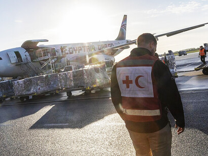Humanitarian teams from ECHO and the IFRC supervise the preparation and transport of relief cargo for Gaza, supporting international efforts to provide assistance to vulnerable communities