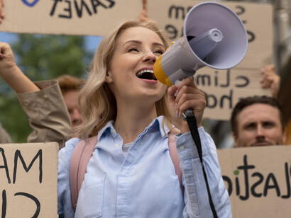 A woman with a megaphone at a rally