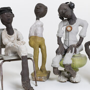 (from left) Horn Player: Louis Armstrong Series, c. 1985–c. 1999; concrete, paint, and mixed media; 32 3/4 x 9 1/2 x 13 1/2 in. Rosa Parks, c. 1985–c. 1999; concrete, paint, and mixed media; 40 x 18 3/4 x 29 in. untitled, c. 1985–c. 1999; concrete, paint, and mixed media; 44 1/2 x 9 1/2 x 12 in. Issues, c. 1985–c. 1999; concrete, paint, and mixed media; 46 x 18 x 25 in. Woman with Fancy Earrings, c. 1985–c. 1999; concrete, paint, and mixed media; 36 x 18 x 10 in. John Michael Kohler Arts Center Collection, gift of Kohler Foundation Inc. 
Photo courtesy of John Michael Kohler Arts Center 
