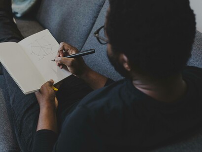 An intern taking a break and writing in his notebook