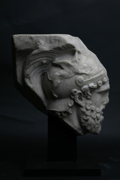 Roman relief fragment depicting the head of Mars, 2nd century AD, Marble, Courtesy of Rupert Wace Ancient Art