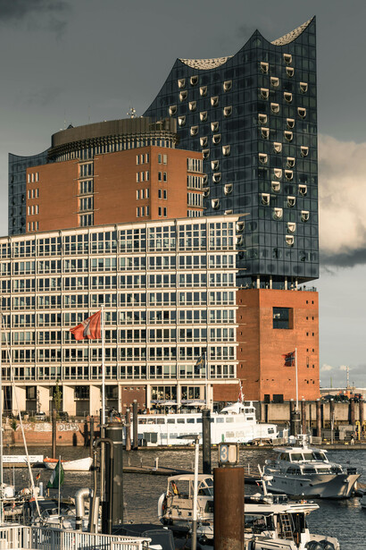 In Hamburg’s HafenCity district on the Elbe River’s Grasbrook peninsula, the Elbphilharmonie—nicknamed the Elphi—stands as a striking fusion of old and new, its wave-like glass façade emerging from the red-brick foundation of a former warehouse near the Speicherstadt