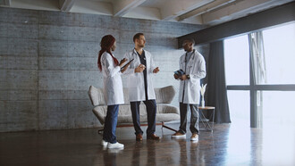 The weight of responsibility hangs in the air as these three doctors connect over shared struggles, each one striving to make a difference despite their own vulnerabilities