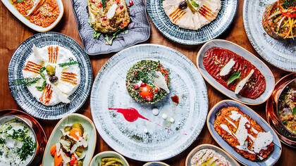 The table is adorned with a stunning display of Turkish appetizers, creating an authentic visual feast that captures the essence of the cuisine