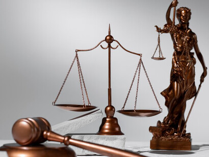 Scales of justice displayed on a white background