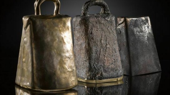 Three recreated early Christian hand bells, each made using a different method, on display in Creative Spirit: Revealing Early Medieval Scotland
