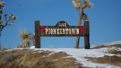 Sign at the town limits of Pioneertown, California, USA, an unincorporated town in San Bernardino County