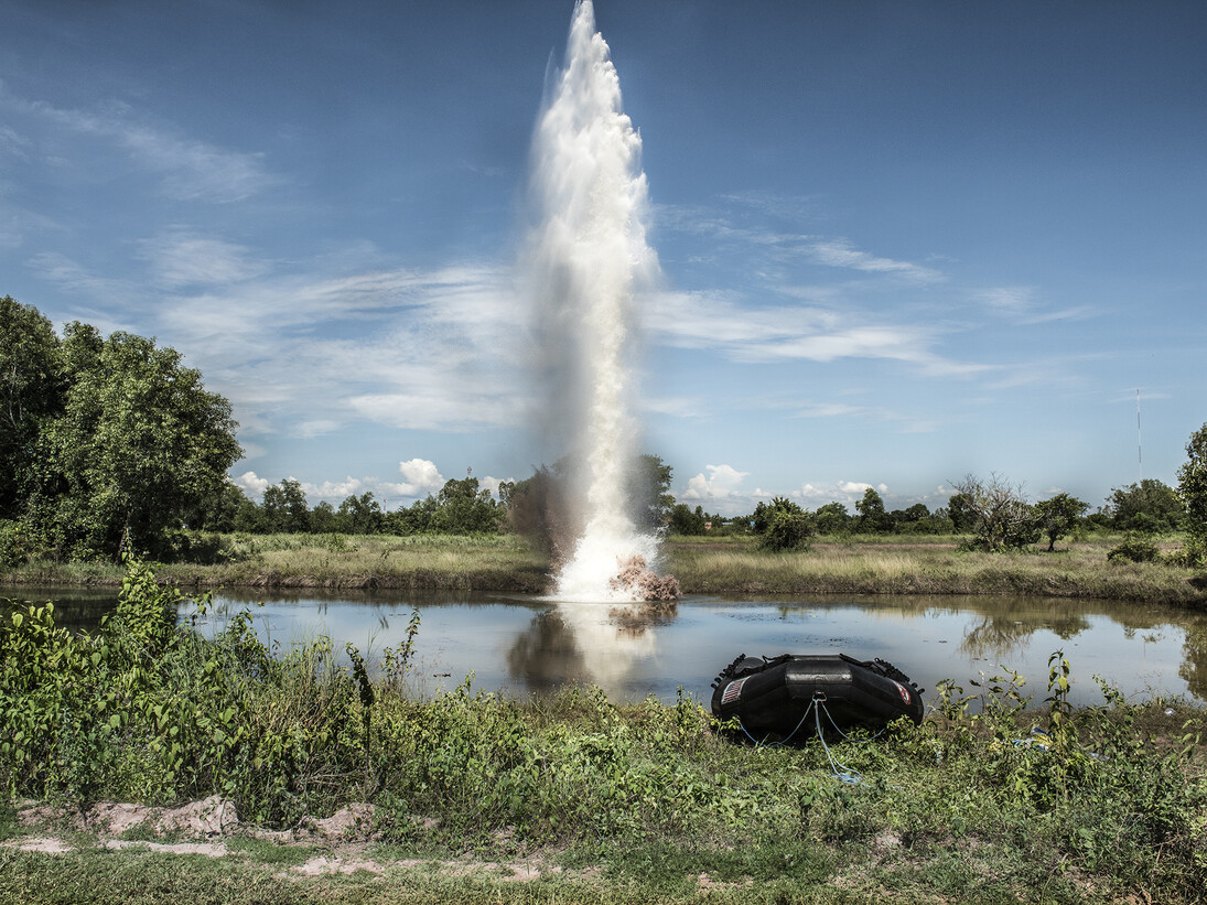 A plume of water shoots into the sky after liquid explosives are
detonated underwater. The explosives where tested to see if they
would be a viable solution to detonate UXO underwater. The test took
place at the divers training centre in Kampong Chhang Province,
Cambodia