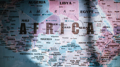 An illuminated section of a map highlighting land and water, showcasing the continent of Africa