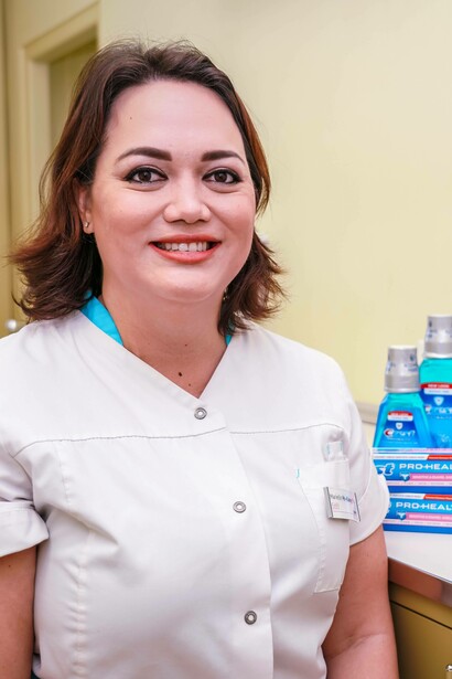 Dentist with mouthwash in the background