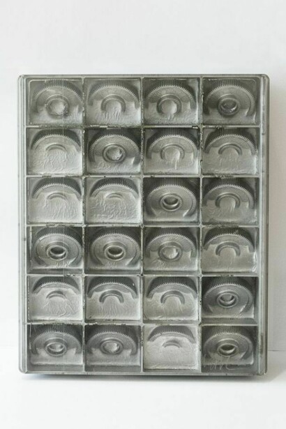Arman, Dual, 1964, cog wheels embedded in polyester, 10 ¾ x 9 x 2 inches (27,3 x 23 x 5,1 cm), Arman © 2013 Artists Rights Society (ARS), New York