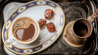 Experience the rich flavor of Turkish coffee with dates served on a tray, perfect for indulgence