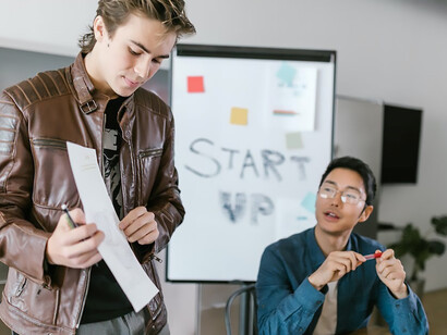 A dynamic young entrepreneur confidently introduces his groundbreaking project, seamlessly merging ambition with a compelling vision, poised to leave a lasting mark on the business landscape