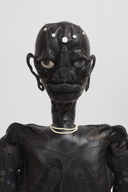 Tau Lewis, 'Harmony', 2021. Recycled leather,
recycled polyester fibres, sand dollars, acrylic
paint, coral, pvc pipe, wire, sea shells, 147.3 x 134.6
x 124.5cm (58 x 53 x 49 1/8in). Copyright Tau
Lewis. Courtesy the artist; Stephen Friedman
Gallery, London and Night Gallery, Los Angeles.
Photo by Pierre Le Hors.