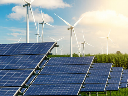 Wind turbines and solar panels generating renewable energy, highlighting the growing role of clean power in achieving energy security and sustainability