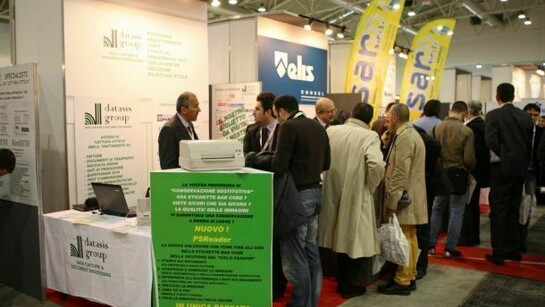 People gathering around stands at SMAU.