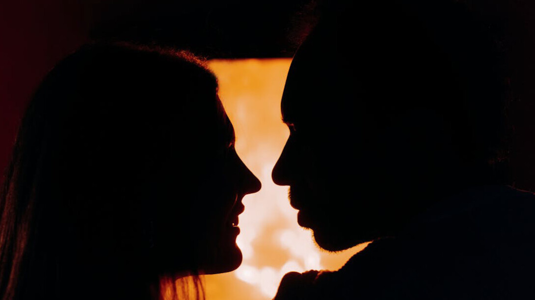 As the flames dance, as the shadows flicker, this couple finds solace in each other's embrace amidst the turmoil of modern relationships, highlighting the enduring warmth of genuine connection amidst a world plagued by superficiality and uncertainty