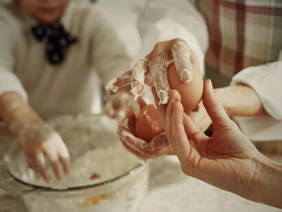 A cozy baking scene in the home office underscores how remote work fosters healthier habits and improved well-being by making time for cooking and relaxation