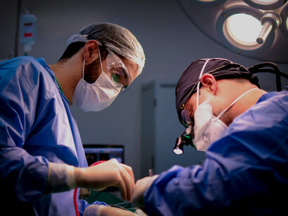 Doctors performing surgery in an operating room