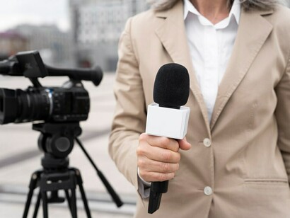 A close-up of a reporter gearing up for an interview, capturing the essence of media censorship, press freedom, and journalistic integrity