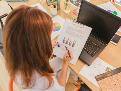 A university student actively engages in learning by studying and analyzing data