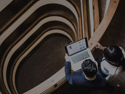 Professionals meet in a bustling hallway, fostering innovation through academic-business collaboration