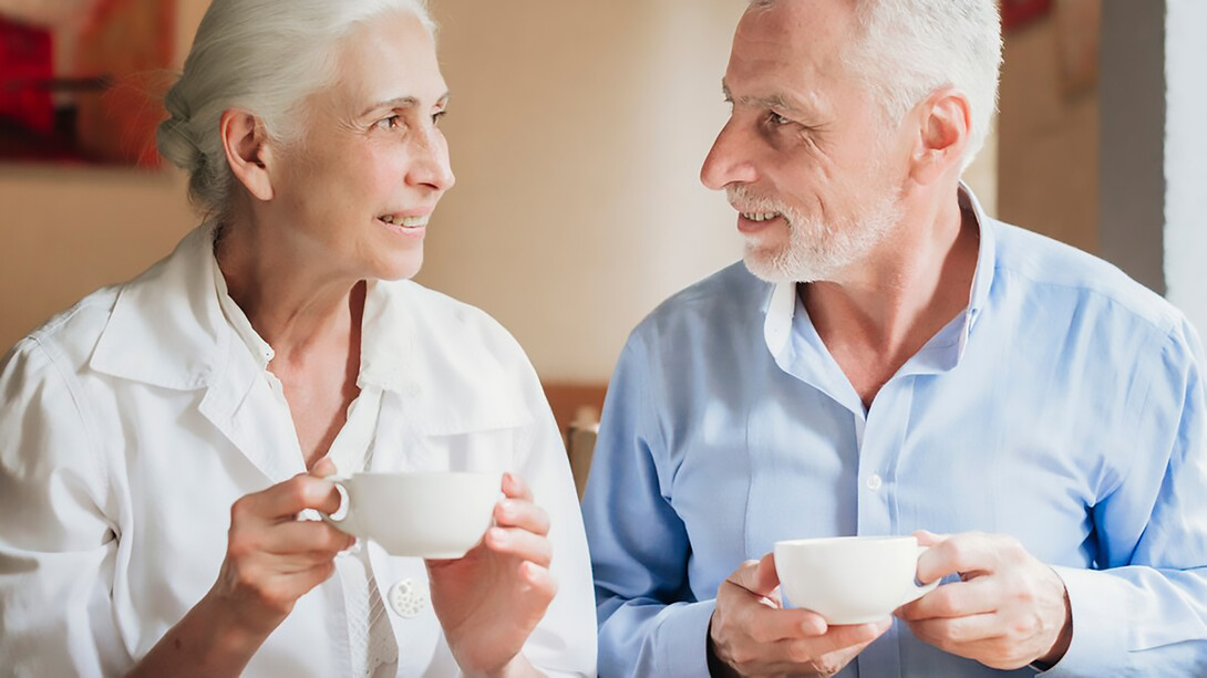 Older adults enjoying tea together, highlighting the benefits of tea antioxidants for bone health
