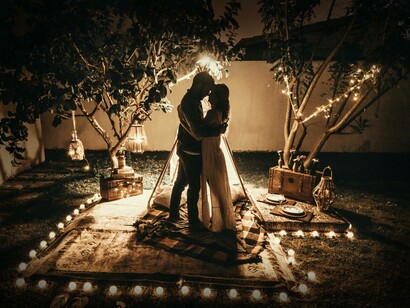 A couple having a night picnic. When the experience of the present, when being with the other is not exhausted in the process itself