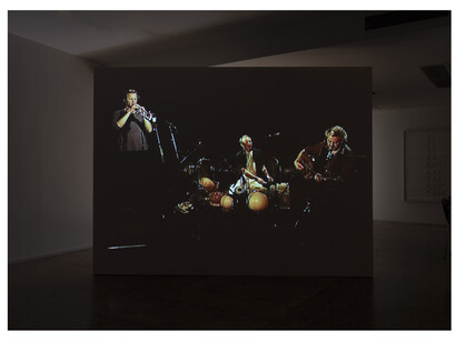 Emily Jacir, ENTRY DENIED (a concert in Jerusalem), 2003, single-channel video (105 minutes), sound, and free-standing wall
Commissioned by O.K Centrum für Gegenwartskunst, Linz, photo: Joerg Lohse
© Emily Jacir