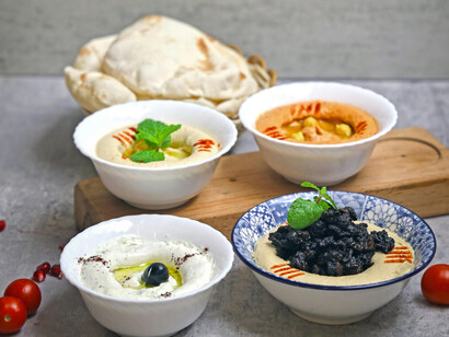 Different dips and some loaves of bread