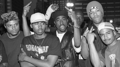 A group of famous rappers from the 90s headlined by Tupak Shakur (center) that influenced the music genre