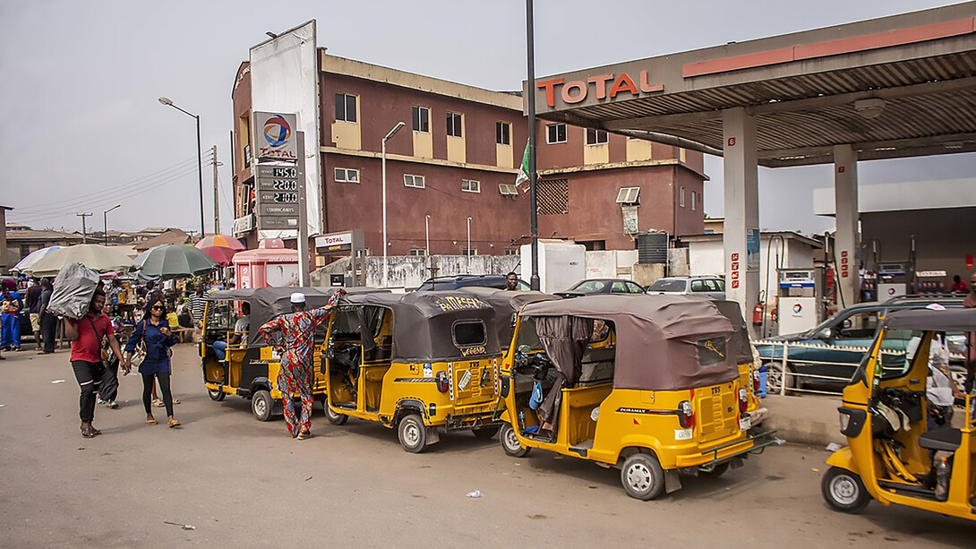 Cars are lined up at a gas station in Nigeria, waiting for petrol amid ongoing fuel scarcity