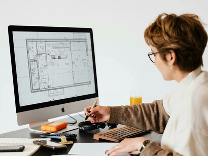 A female architect concentrating on a business project while working in her office