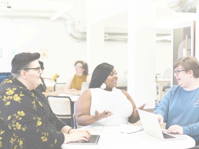 A diverse set of women at the workplace having an enjoyable time where there's no sign of discrimination at work