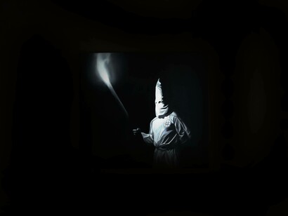 Tyrone Egbowon's artwork of a man in a Ku Klux Klan uniform holding a torch