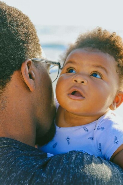 Baby held up by mother
