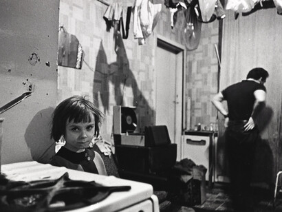 Mr and Mrs Gallagher lived with their 4 children in a ground floor tenement flat. Their bedroom was covered in pools of rainwater. At night they sleep with the light on to keep the rats away. One night they counted 16 rats in the room. Glasgow Maryhill, October 1970 © Nick Hedges / National Media Museum, Bradford