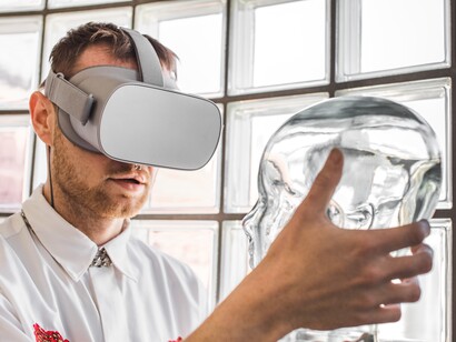 A young doctor immersed in a VR simulation examines a mannequin, illustrating the evolving relationship between AI and human expertise