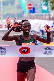 Woman running to win a race