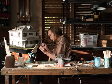 Annie builds incredibly detailed miniatures of her life, including traumatic moments