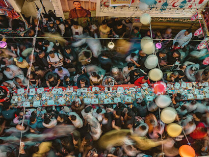 Muslims in Cairo, Egypt, eagerly await sunset during Ramadan, gathering for the Mataraya Iftar, one of the largest free iftar events in the world