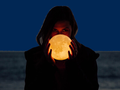 A woman holding the moon. Researchers estimate 11 tons of Moondust annually would make the Earth's surface 2 percent dimmer