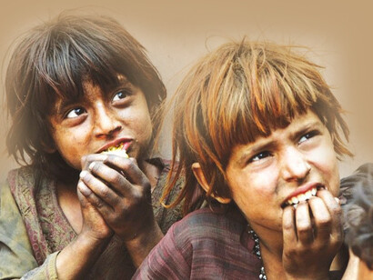 Small children in the streets, hungry and waiting to be fed, alone after losing their parents