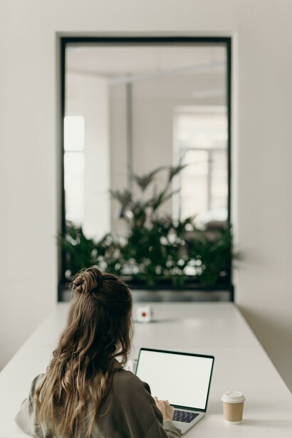 A woman using a laptop at a desk.
Technology is advancing much faster than our capacity to change institutions  