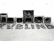 Bill Woodrow RA, T.V. Blind, 1979, 7 Televisions, 89 x 160 x 352 cm, Collection of the artist