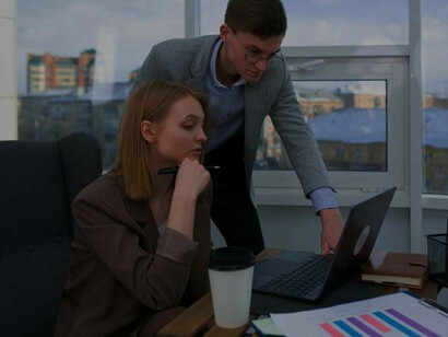 Two young business venturers looking over their pitch to investors