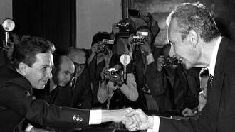 The “Compromesso Storico” summarized in a handshake between Enrico Berlinguer (PCI) and Aldo Moro (DC)