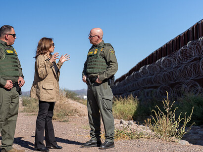 Vice President Kamala Harris speaks with Border Patrol officials as she visits the U.S.-Mexico border wall, Friday, September 27, 2024, in Douglas, Arizona, USA